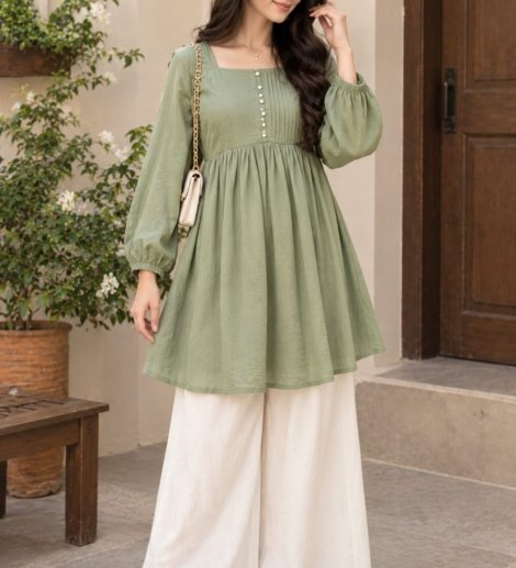 Woman wearing a sage green short pleated frock with off-white wide leg palazzo trousers