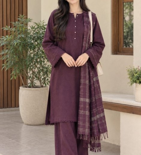 Woman wearing a deep plum solid 3 piece suit with a matching checked shawl
