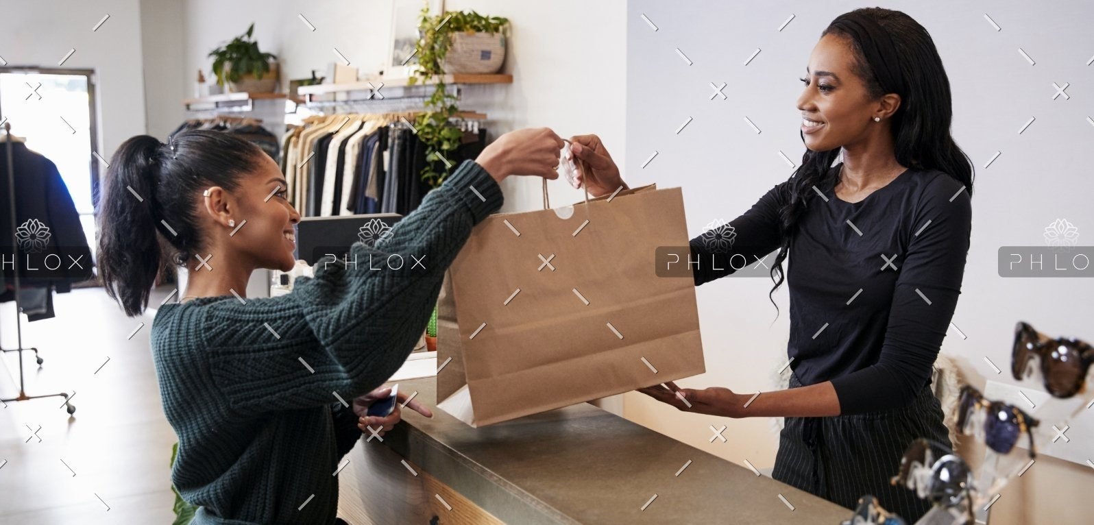 demo-attachment-551-woman-serving-customer-at-the-counter-in-a-P5ATKGN@2x